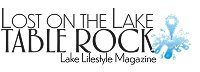 Logo for Lost on the Lake TABLE ROCK Lake Lifestyle Magazine, featuring bold black text, a blue water splash graphic, and a stylized water droplet within the design.
