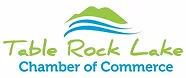 Logo for Table Rock Lake Chamber of Commerce with a green mountain, blue water waves, “Table Rock Lake” in green script, and “Chamber of Commerce” in blue text below.
