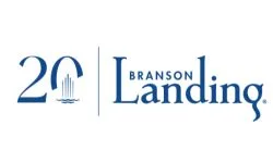 Logo with 20 and a vertical fountain graphic on the left, separated by a line from the text Branson Landing in blue font on the right.