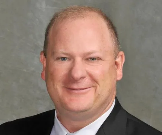 Man in Suit Jacket and Gray Turtleneck