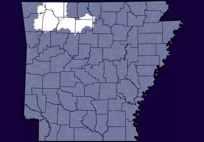 Map of Arkansas counties with several counties in the northwest region highlighted in white, while the rest of the counties are shaded in blue.